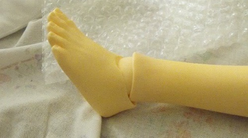 The backs of the ankles are cut-in to allow for the toes to be able to point downward better.